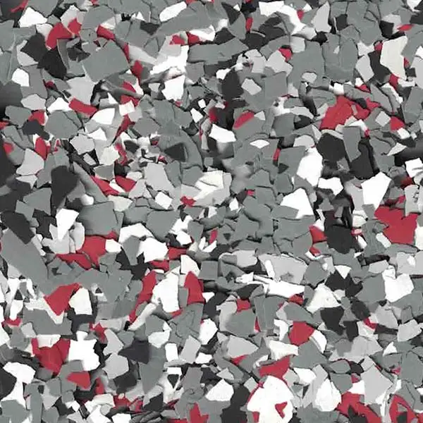 A textured surface with scattered multicolored flakes in shades of gray, white, and red, creating a speckled, mosaic-like pattern.