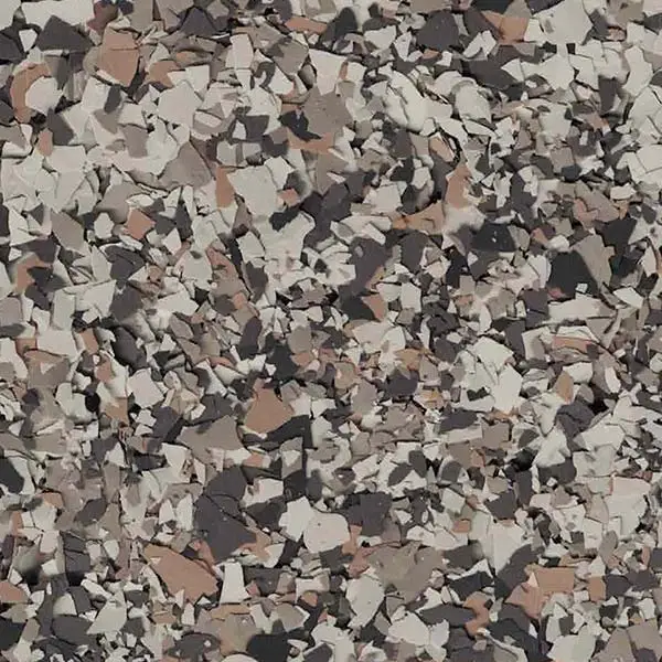 The image shows a close-up view of a textured surface with a mix of gray, black, and brown flecks, resembling a terrazzo pattern.