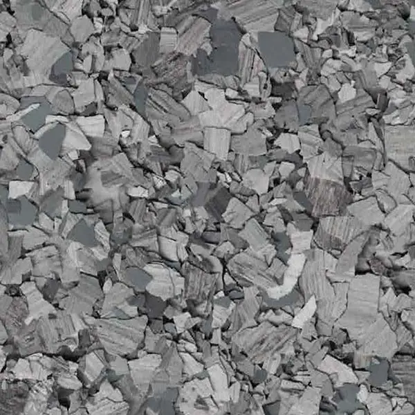 A close-up view of a gray, rocky texture with irregular shapes and varying shades, creating a natural, abstract pattern. No landmarks visible.