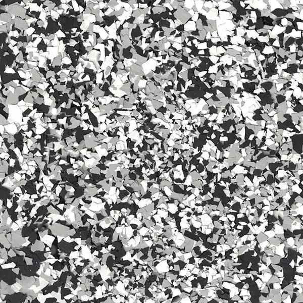Abstract black, white, and gray flake pattern creating a dynamic and textured design, resembling scattered fragments over a dark background.