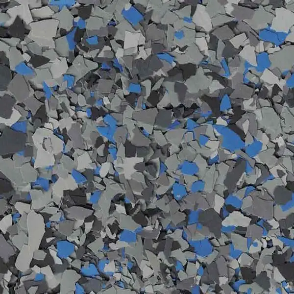 A textured surface with scattered blue, gray, and black irregular shapes, resembling a terrazzo pattern or decorative flooring, with no identifiable landmarks.