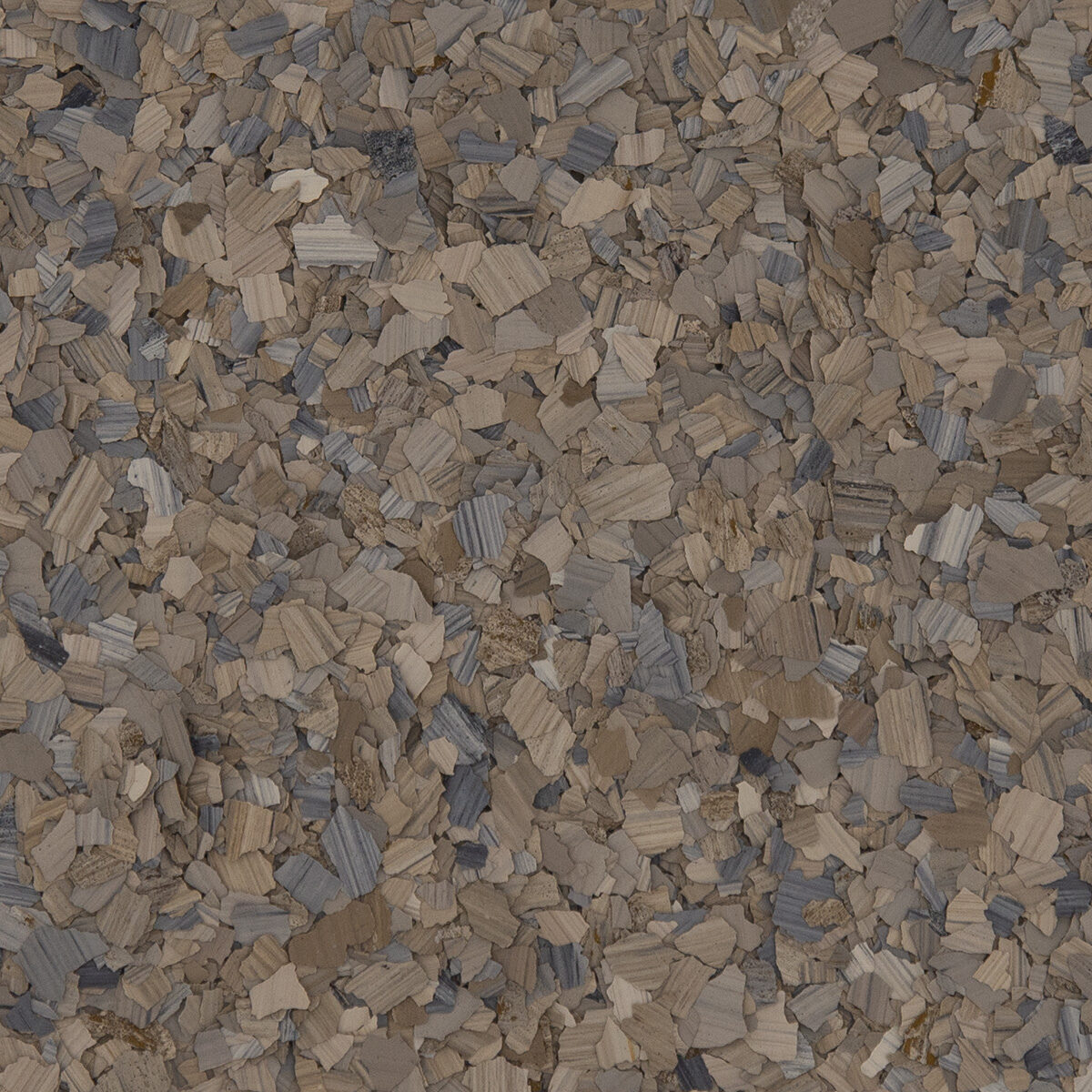 Cork bark chips, in shades of beige, brown, and gray, are scattered, creating a textured background with natural, earthy tones throughout.