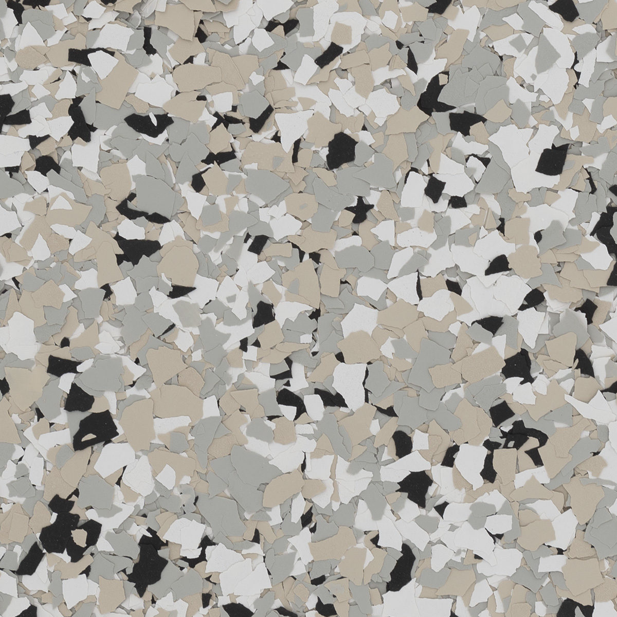 Colorful, irregular paint chips in beige, grey, black, and white create a textured, abstract pattern resembling camouflage or terrazzo flooring. No people or landmarks visible.