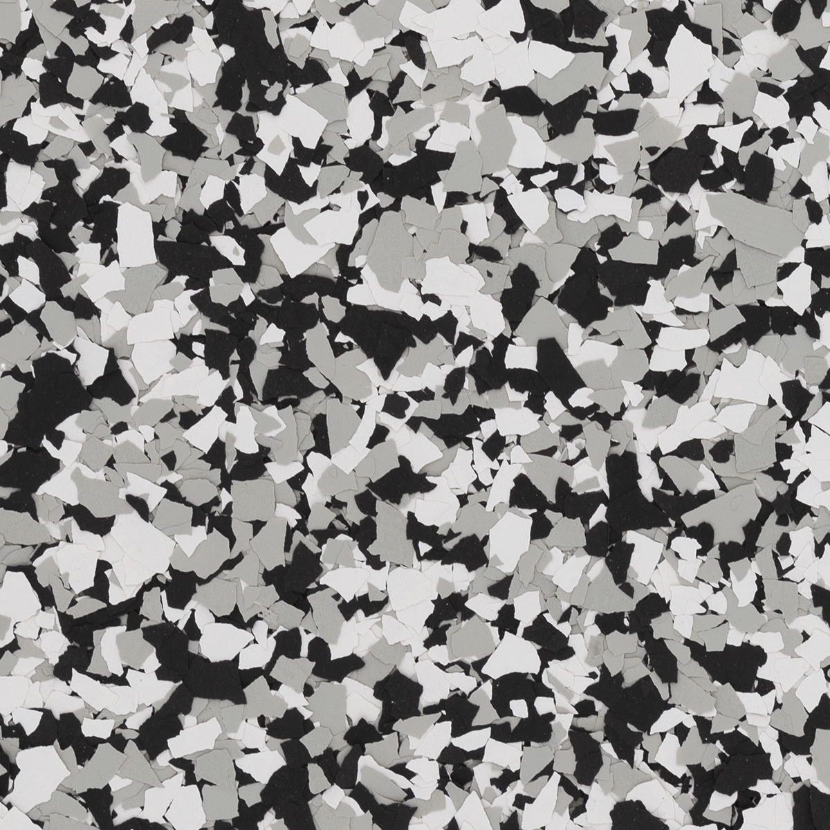 This image features a speckled pattern of black, white, and gray irregular shapes scattered evenly across the surface, resembling terrazzo flooring.