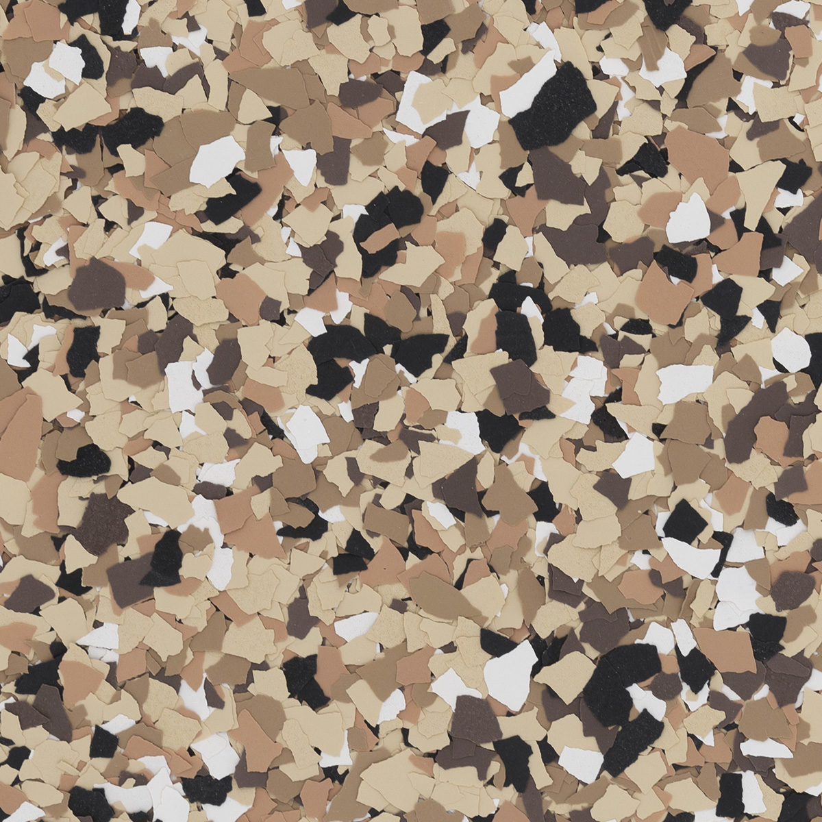 Speckled surface covered with multicolored, irregular fragments in shades of tan, brown, black, and white, creating a textured, abstract pattern.