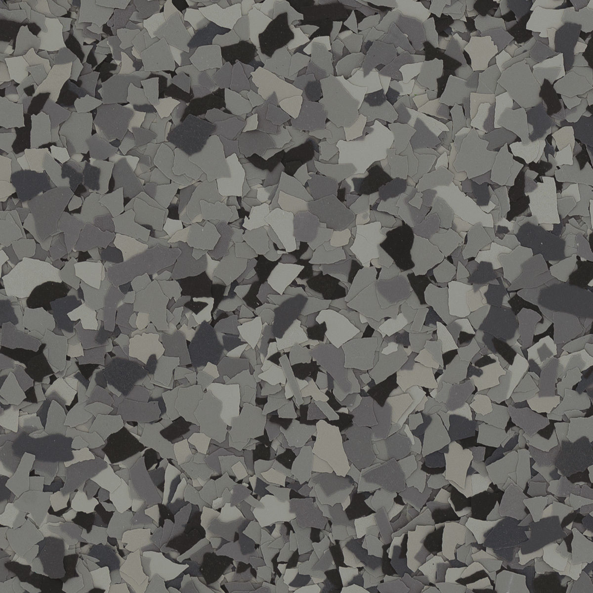 The image shows a dense pattern of small, irregularly shaped gray and black fragments, resembling a camouflaged or terrazzo surface.