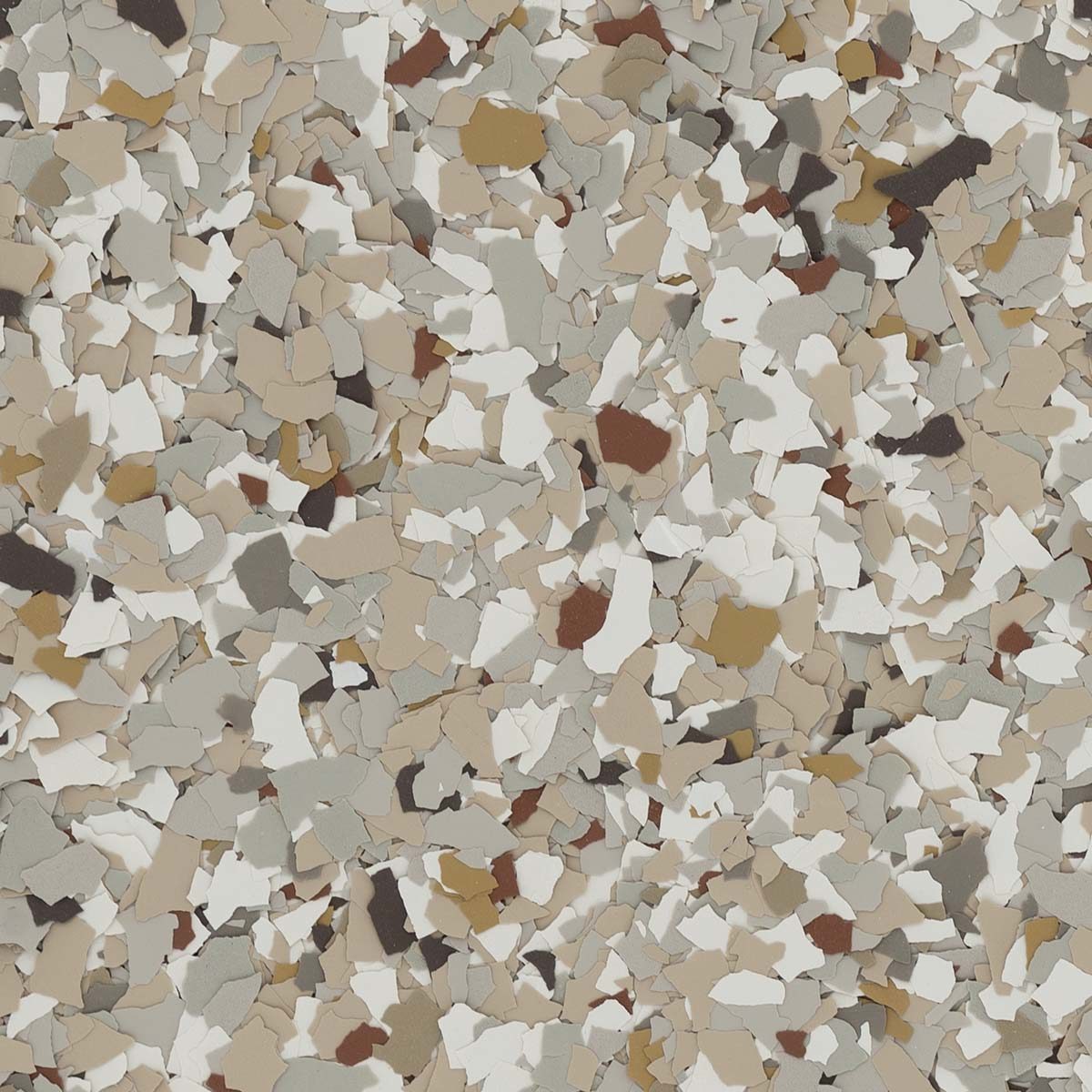 A close-up image of multicolored decorative chips scattered randomly, featuring hues of beige, white, gray, and brown, creating an abstract pattern.