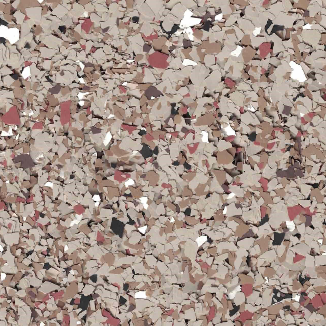 A scattered pattern of small, irregularly shaped chips in shades of brown, red, and white on a flat surface. No landmarks visible.